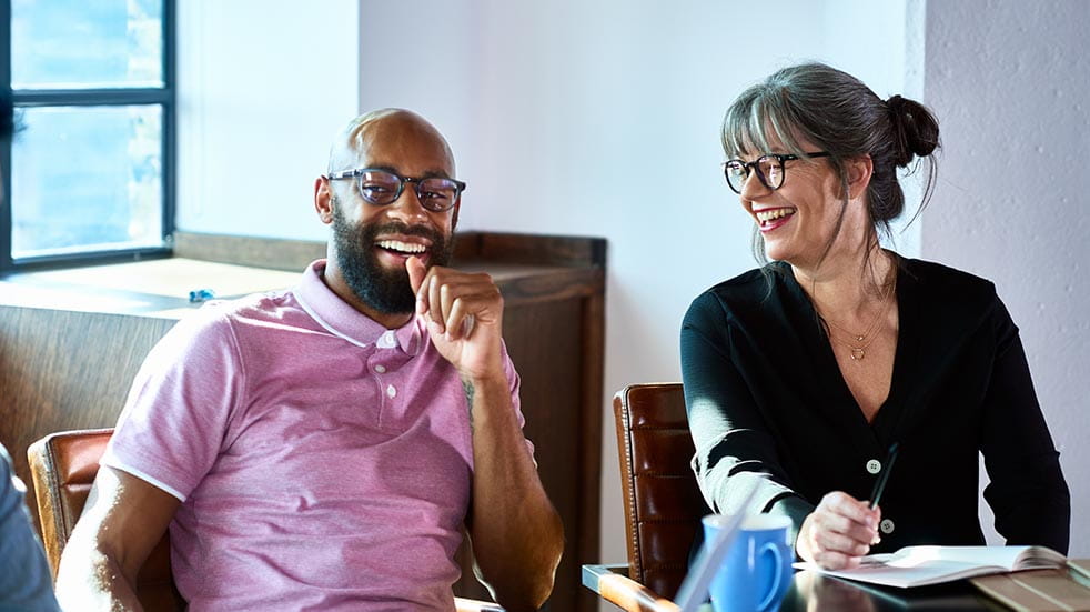 Work activities; man and woman laughing